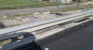 defective metal beam crash barrier